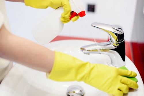 Window cleaner using modern equipment in Tooting
