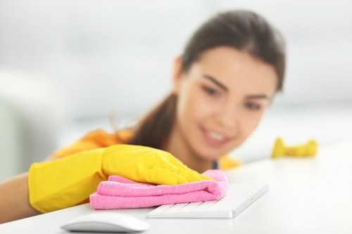 Disinfecting high-touch surfaces in a shared building